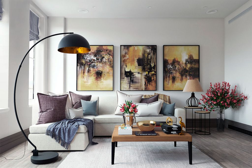 Интерьер дома в светлых цветах с тремя картинами